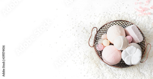 Bath bombs in a metal basket. Body care concept. photo