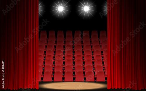 spotlight and red curtain on the wooden stage in the hall