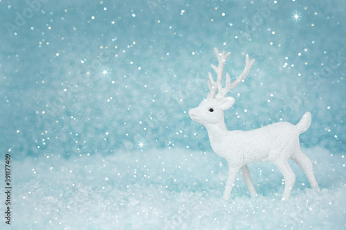 Christmas deer on a snowy background. New year card. Xmas concept with copy space. © Marina Kaiser