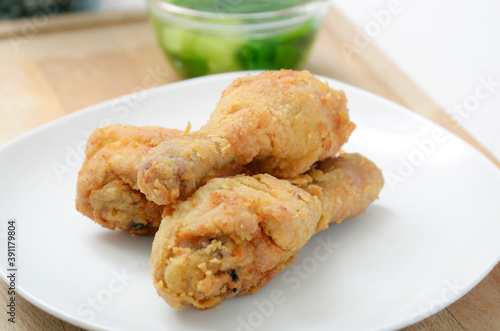 Crispy Fried Chicken Drumsticks, with vegetable soup as a background