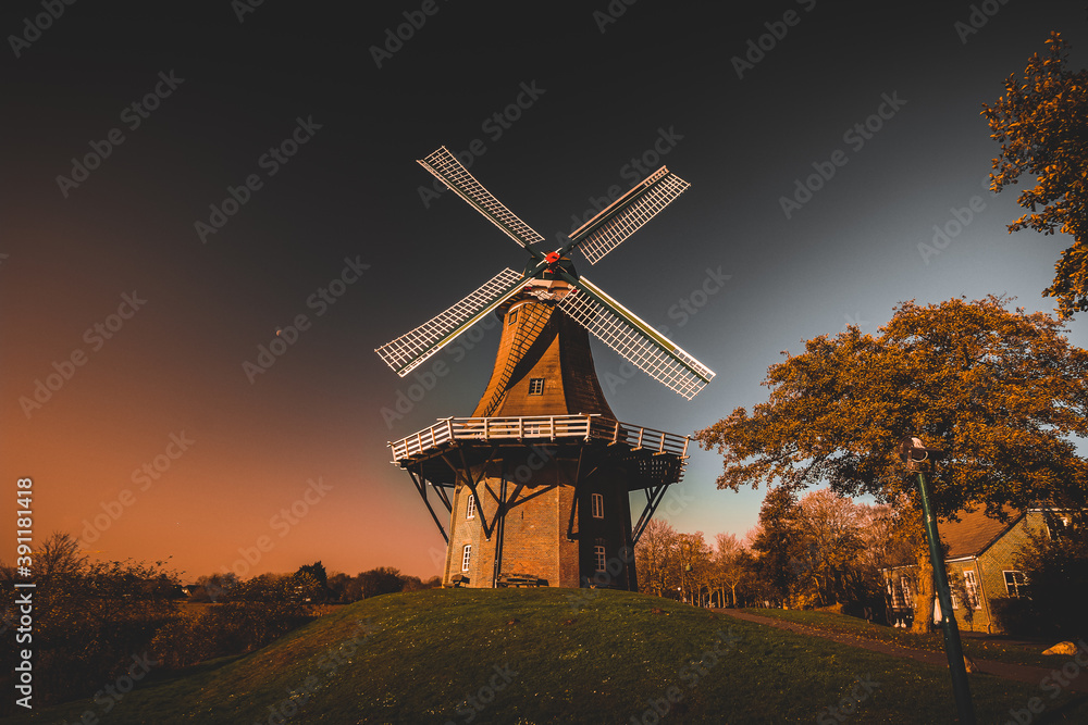 an old windmill by the water