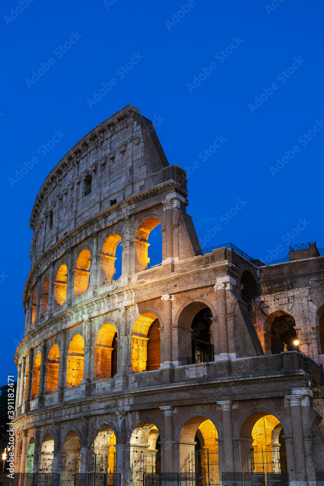 Colosseum Amphitheatre At Night In Rome, Italy