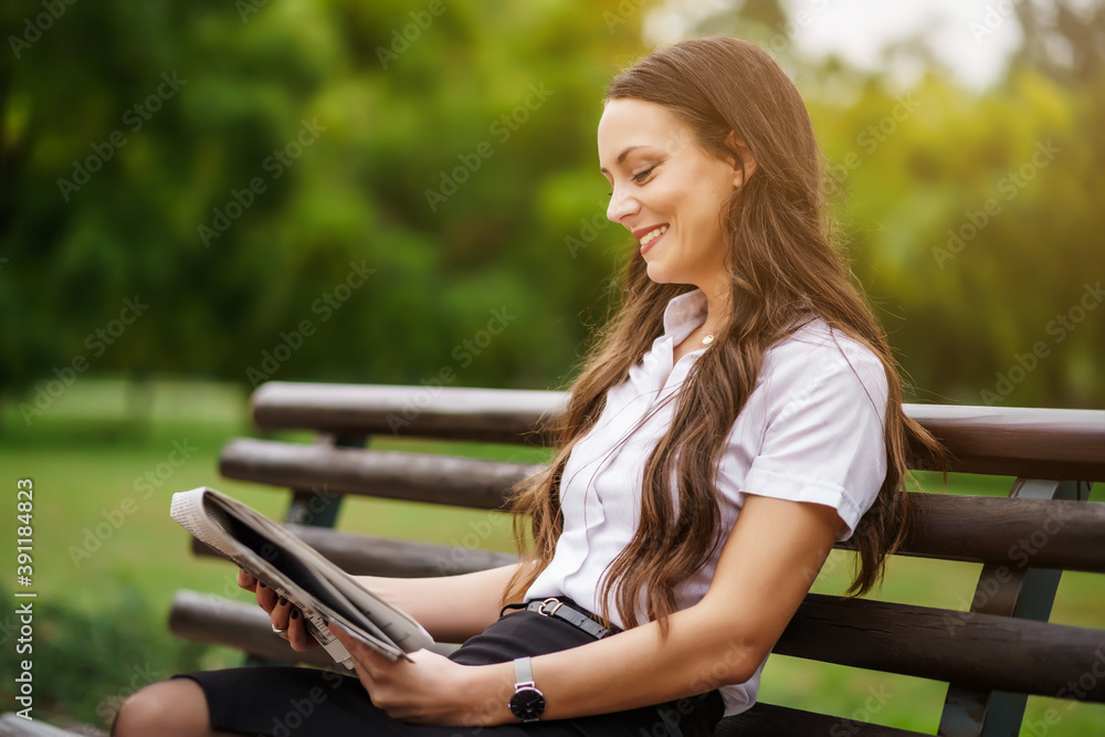 Businesswoman is relaxing on break. She is reading newspapers. Businesswoman is relaxing on break. She is reading newspapers.