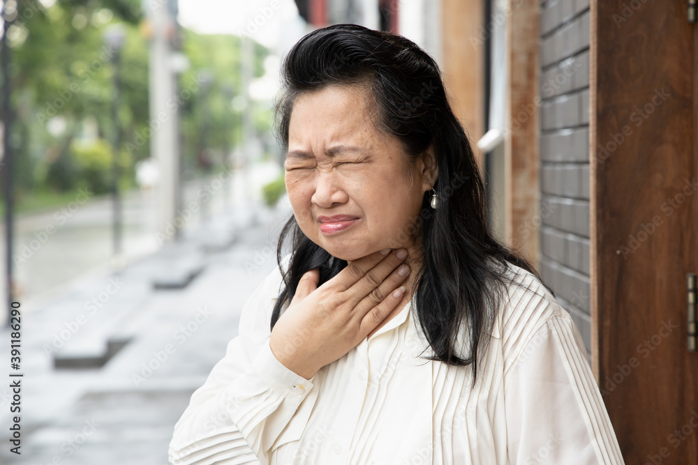 sick allergic senior woman having sore throat with cold, flu or coronavirus infection, COVID-19 symptom sick allergic senior woman having sore throat with cold, flu or coronavirus infection, COVID-19 symptom