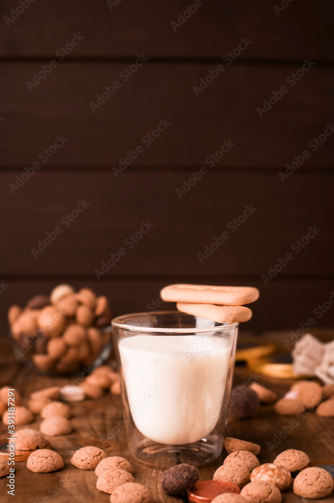 Sinterklaas. A glass of milk and birthday cookies for a traditional Dutch holiday. A treat for St. Nicholas. Copy space. High quality photo Sinterklaas. A glass of milk and birthday cookies for a traditional Dutch holiday. A treat for St. Nicholas. Copy space. High quality photo