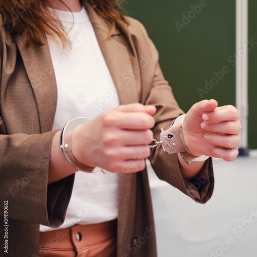 Teacher in handcuffs, school and university bribery problem concept