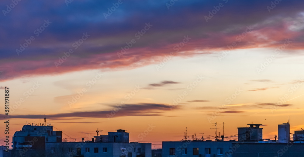 Sunset over the houses of the city