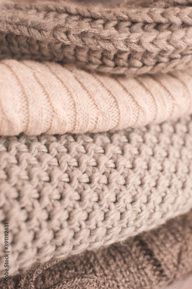 Set of cozy knitted sweaters in stack close up. Winter season. Set of cozy knitted sweaters in stack close up. Winter season.