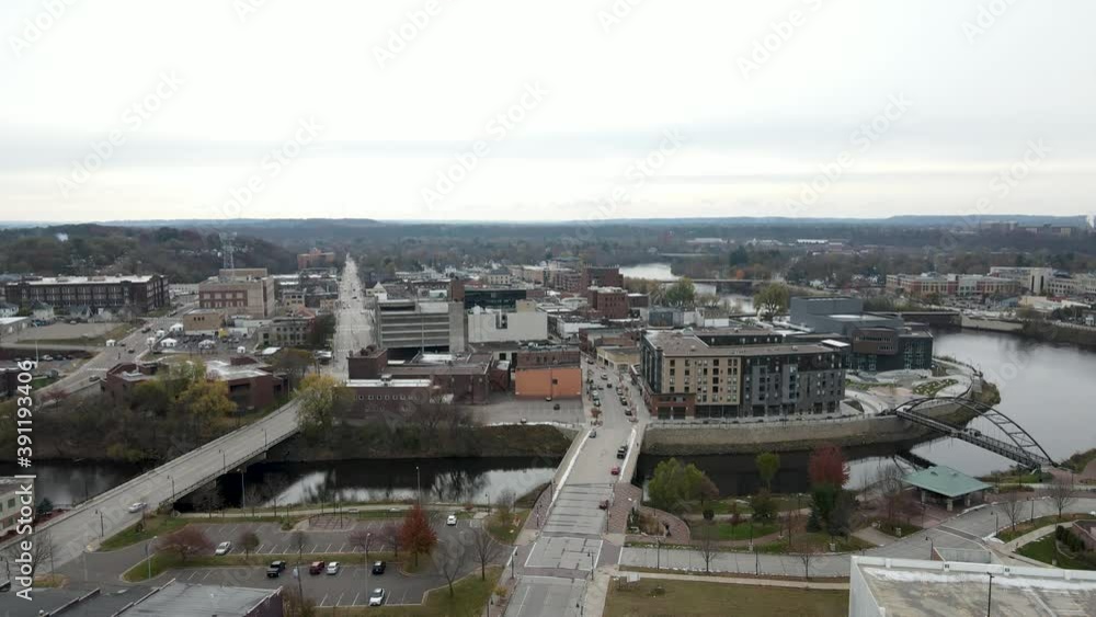 Bridges across the river in industrial city center. Aerial view of buildings in downtown Eau Claire in Wisconsin, USA. Bridges across the river in industrial city center. Aerial view of buildings in downtown Eau Claire in Wisconsin, USA.
