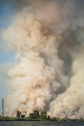 Large clouds of smoke, fire in nature.