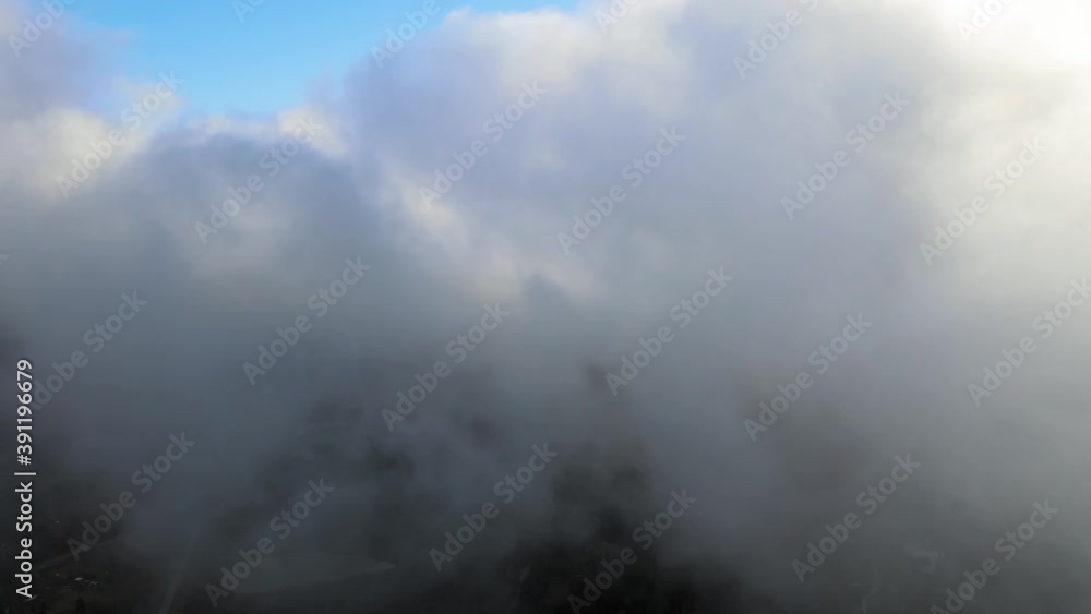 Flying through the clouds above mountain tops. High peaks wonderful morning sunrise natural Landscape Flying through the clouds above mountain tops. High peaks wonderful morning sunrise natural Landscape