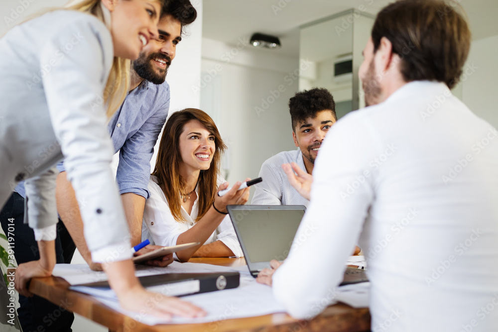 Group of business people meeting in office, sharing their ideas. Group of business people meeting in office, sharing their ideas.