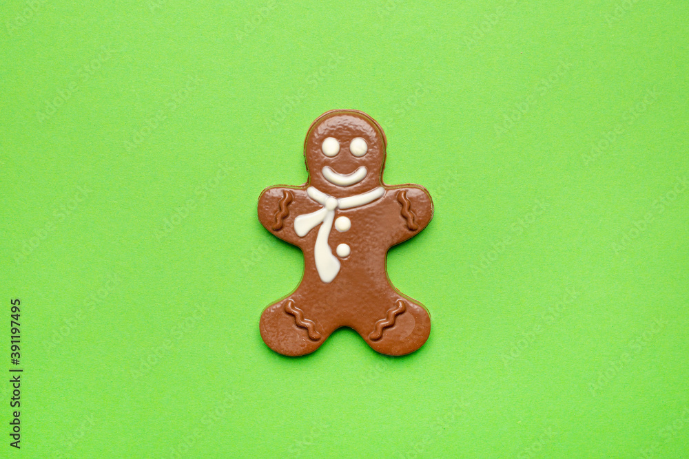 Chocolate figurine of a gingerbread man on a green background , New year and Christmas holidays Chocolate figurine of a gingerbread man on a green background , New year and Christmas holidays