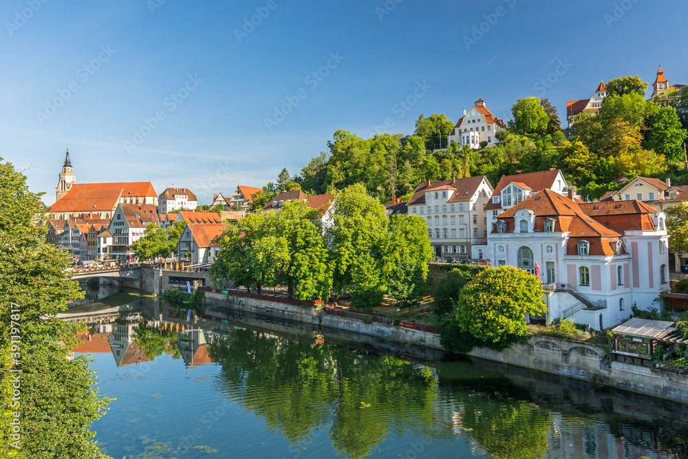 Historic villas along the Neckar river in the German city of Tübingen on a sunny day in summer