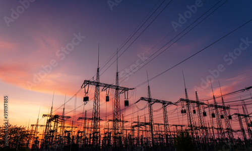 Electrical substation silhouette on the dramatic sunset background photo
