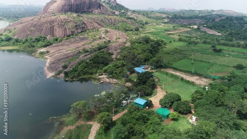 Aerial circling over cultivated lands near the river photo