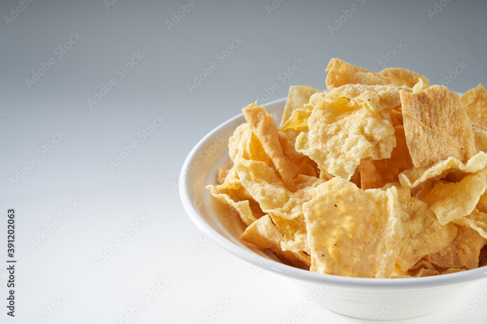 Closeup of a bowl of golden tempting fried yuba