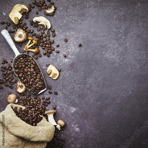 Mushroom Chaga Coffee Superfood Trend-dry and fresh mushrooms and coffee beans on dark background. Copy space, top view. Concept of trend modern food industry. © Natalia Klenova