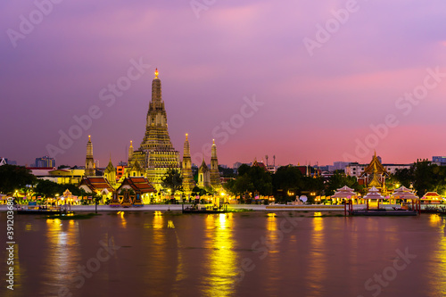 Wat Arun with Chao Phraya river at sunset in Bangkok, Thailand