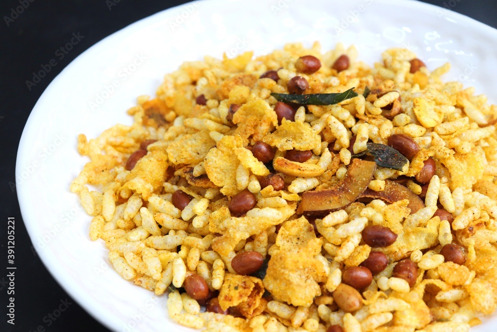 Murmura cornflakes Chivda or Chiwada. Diwali special savory snack mixture, made out of puffed rice, fried peanuts, curry leaves, and some spices. Traditional Indian Diwali Snacks. with Copy Space. Murmura cornflakes Chivda or Chiwada. Diwali special savory snack mixture, made out of puffed rice, fried peanuts, curry leaves, and some spices. Traditional Indian Diwali Snacks. with Copy Space.