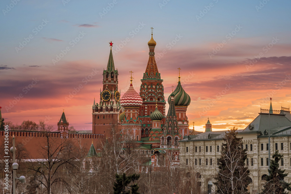 The Moscow Kremlin and St. Basil Cathedral in front of colorful sunset. View from Zaryadye Park