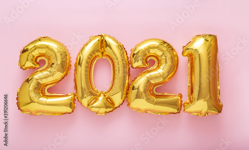 2021 Happy New year eve invitation. 2021 Golden air balloon numbers on pink background.
