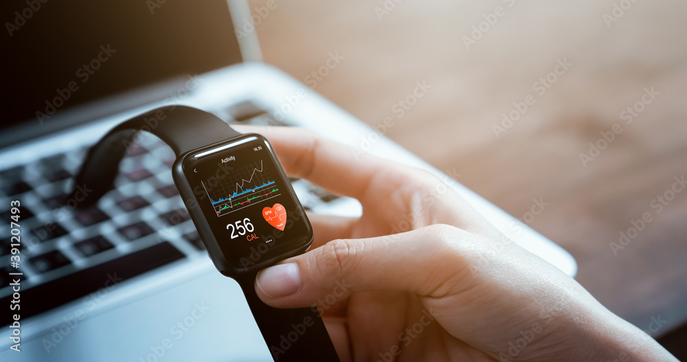 Close up of hand touching smartwatch with health app on the screen, gadget for fitness active lifestyle. - obrazy, fototapety, plakaty 