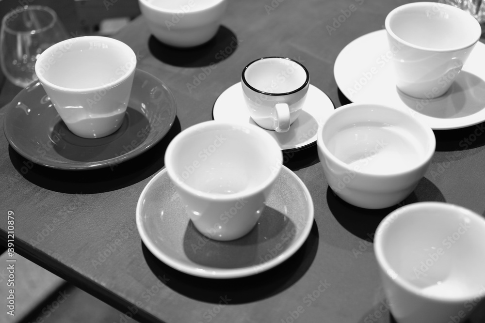 Empty cups on the table. Tea set. Black and white photo. Empty cups on the table. Tea set. Black and white photo.