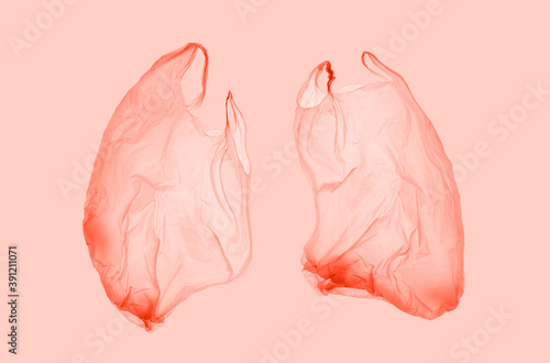 Pink plastic bag in pink light in form of lungs. World pneumonia day. Pneumonia. Covid.