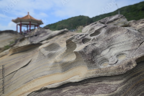 Weathered rock against the blurred background taken at Guihou Beach, Taiwan. photo