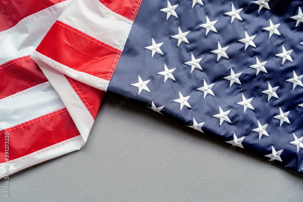 Obraz premium Veterans day. Honoring all who served. American flag on gray background with copy space.
