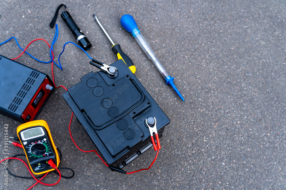 Top view of the battery and tools for diagnosing and repairing the battery.