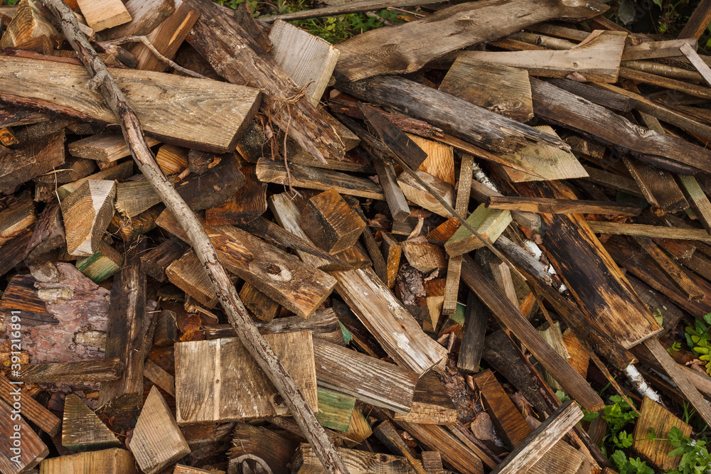 Background of firewood. Preparation of firewood for the winter. The place for the felling of firewood Background of firewood. Preparation of firewood for the winter. The place for the felling of firewood