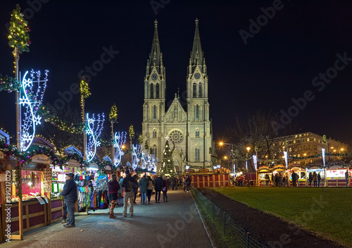 Prague, Czech Republic. Christmas market at Namesti Miru (Peace Square) in front of St. Ludmila Church in night.