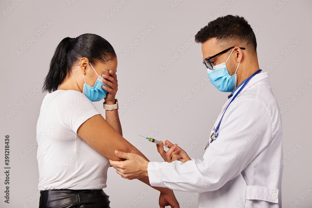Concept of medicine and health care The doctor giving the patient a coronavirus vaccine Concept of medicine and health care The doctor giving the patient a coronavirus vaccine