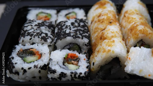 Sushi roll set with smoked eel and caviar, selective focus. photo