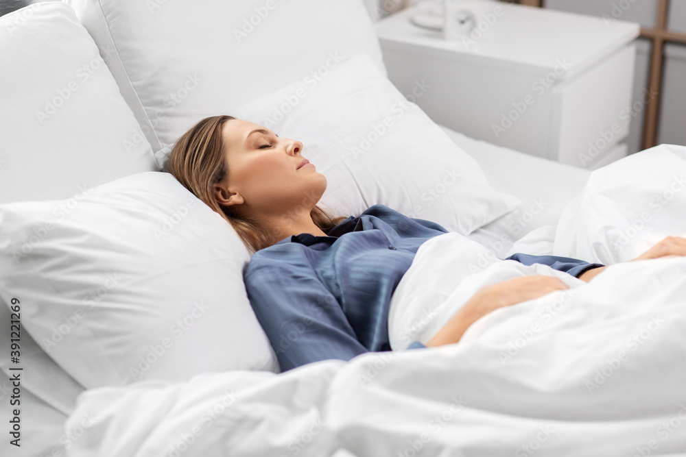 people, relax and comfort concept - young woman sleeping in bed at home people, relax and comfort concept - young woman sleeping in bed at home