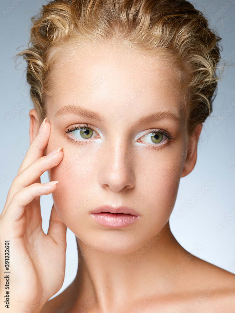 Beauty portrait of blonde girl with perfect glowing skin Beauty portrait of blonde girl with perfect glowing skin