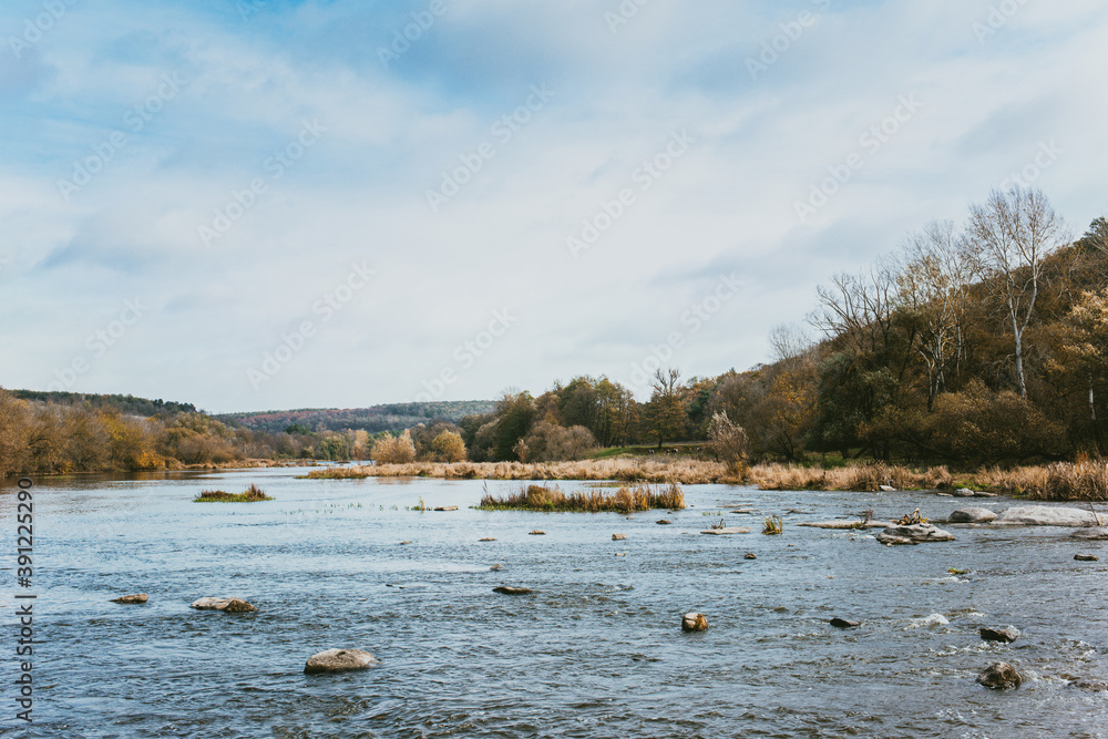 Beautiful autumn landscape with a river and a forest. Beautiful autumn landscape with a river and a forest.