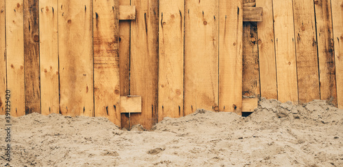 Worn wooden beach fence as background and copy space