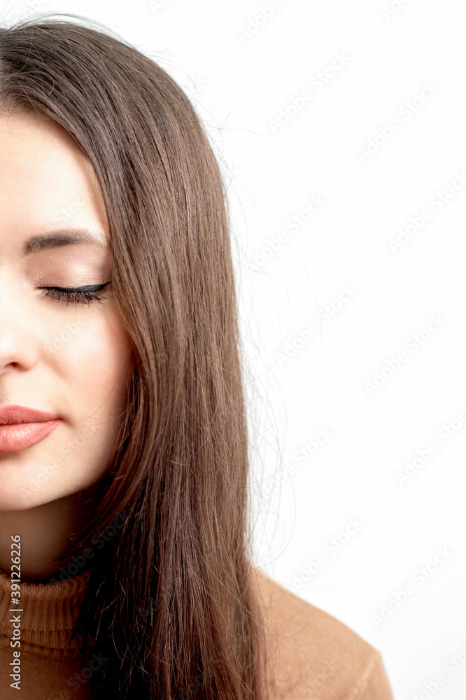 Half face female beauty portrait with makeup and closed eye on white background Half face female beauty portrait with makeup and closed eye on white background
