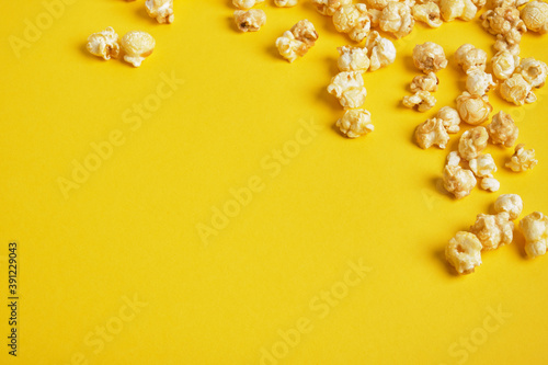 Popcorn on yellow background. frame copy sapce