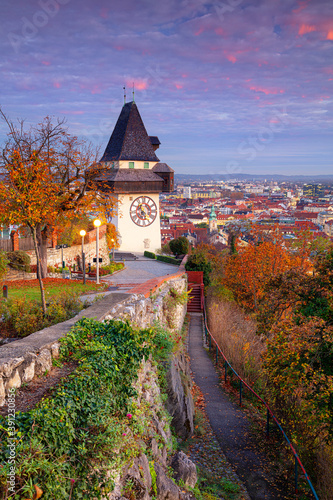 Obraz na płótnie Graz, Austria. Cityscape image of the Graz, Austria with the Clock Tower at beautiful autumn sunset. w salonie