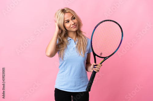 Young Russian woman playing tennis isolated on purple background thinking an idea © luismolinero