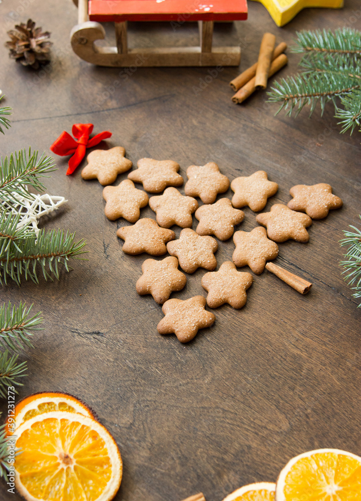 Christmas tree made of gingerbreads on a wooden background. Christmas, new year, festive, kids, food concept. free space for text Christmas tree made of gingerbreads on a wooden background. Christmas, new year, festive, kids, food concept. free space for text