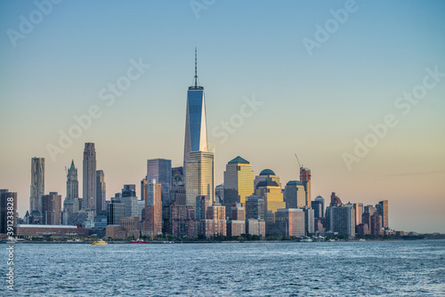 Amazing sunset colors of Lower Manhattan skyline from the ferry boat  New York City