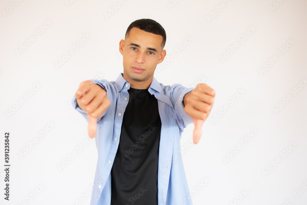 cool man with thumbs down over white background cool man with thumbs down over white background