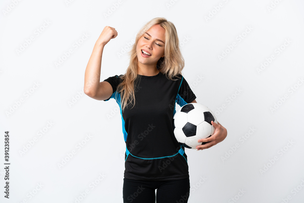 Young Russian woman playing football isolated on white background celebrating a victory