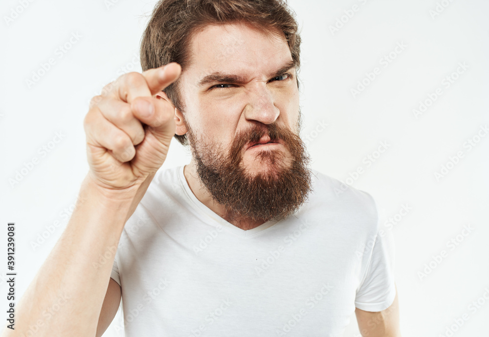 Aggressive man irritability emotions gesturing with model hands Aggressive man irritability emotions gesturing with model hands