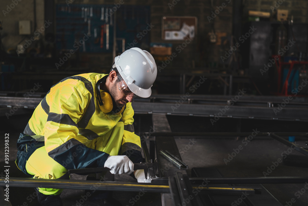 Fototapeta premium Mechanic/Worker use the tool measuring the part in metal factory